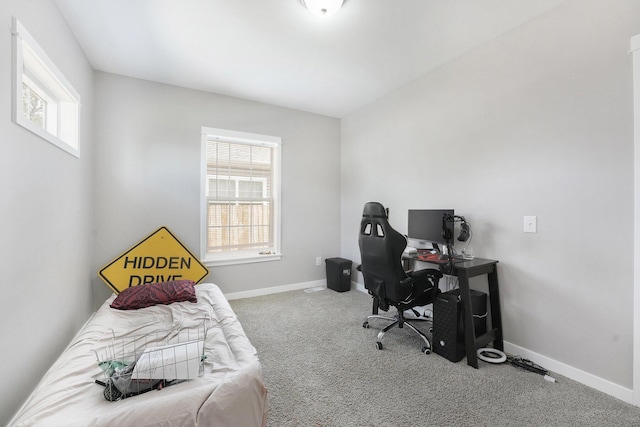 carpeted bedroom featuring baseboards