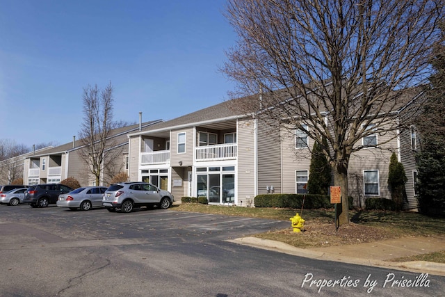 3025 Poplar Creek Dr SE Unit 104, Grand Rapids, MI 49512 - view of building exterior with uncovered parking