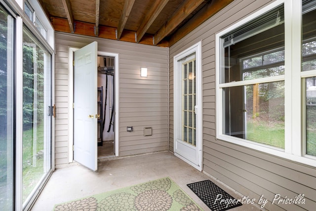 3025 Poplar Creek Dr SE Unit 104, Grand Rapids, MI 49512 - unfurnished sunroom with plenty of natural light