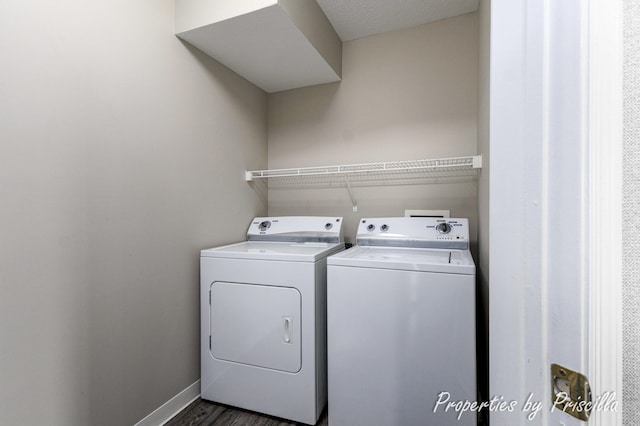 3025 Poplar Creek Dr SE Unit 104, Grand Rapids, MI 49512 - washroom featuring separate washer and dryer and baseboards