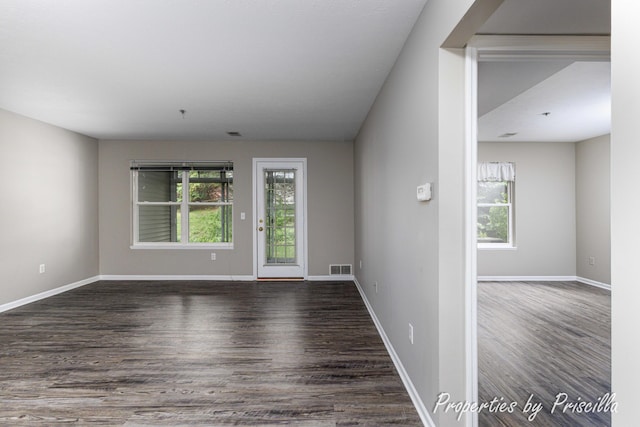 3025 Poplar Creek Dr SE Unit 104, Grand Rapids, MI 49512 - spare room with plenty of natural light, wood finished floors, and baseboards