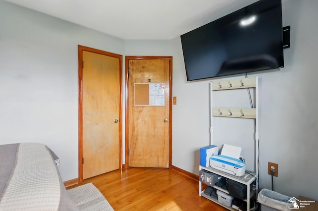 bedroom with wood finished floors