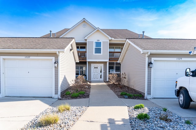 1533 Weatherstone Dr, Ann Arbor, MI 48108 - view of front of home featuring driveway, a shingled roof, and an attached garage
