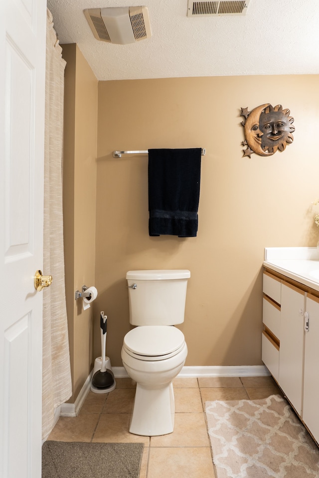 1533 Weatherstone Dr, Ann Arbor, MI 48108 - bathroom with tile patterned floors, toilet, vanity, and baseboards