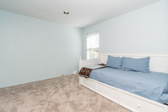 carpeted bedroom with baseboards