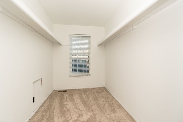 spacious closet featuring carpet flooring and visible vents