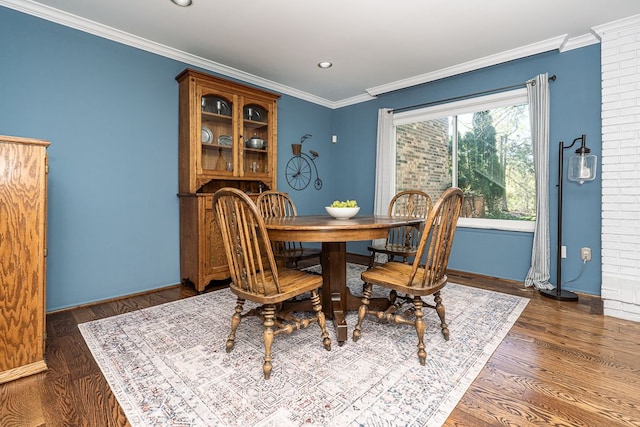 dining area with recessed lighting, baseboards, ornamental molding, and wood finished floors