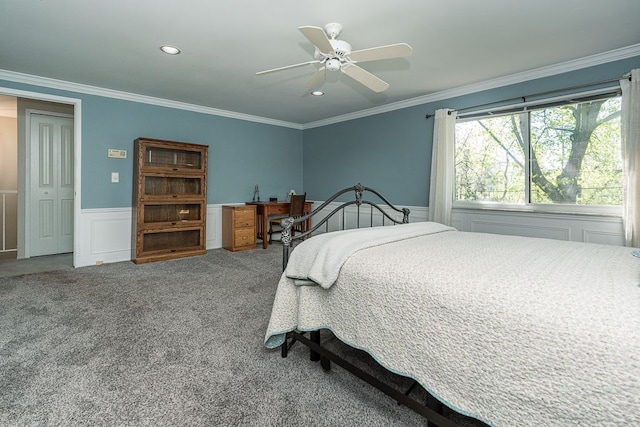 carpeted bedroom with ceiling fan, a wainscoted wall, ornamental molding, a decorative wall, and recessed lighting