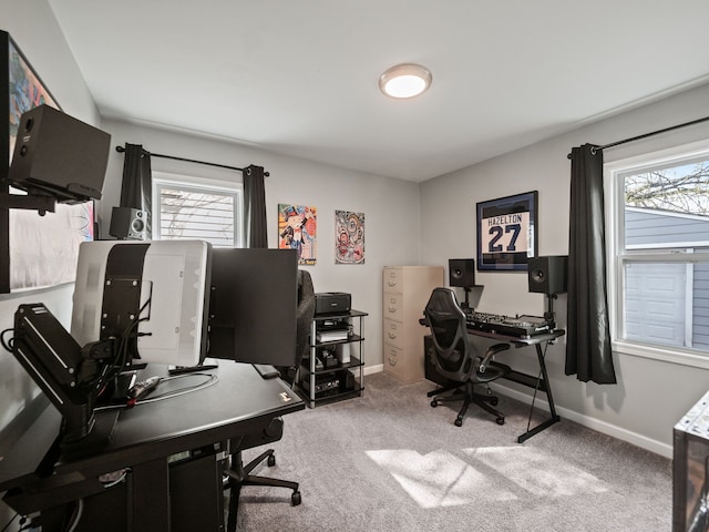 carpeted home office featuring baseboards