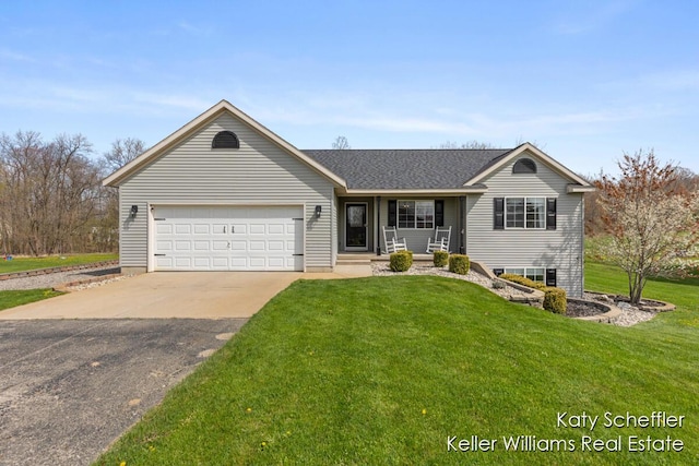 ranch-style home with a porch, an attached garage, concrete driveway, and a front lawn