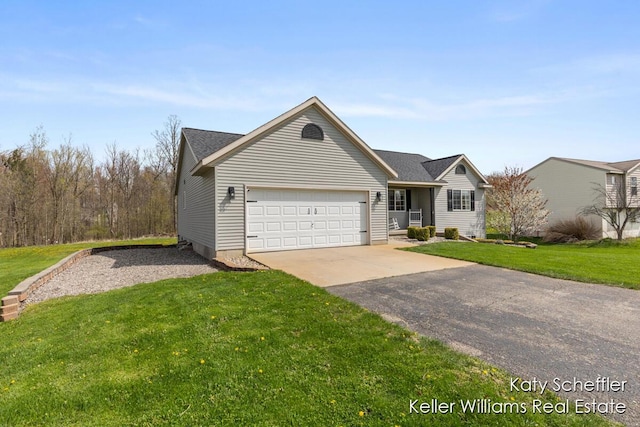 single story home with a garage, driveway, and a front lawn