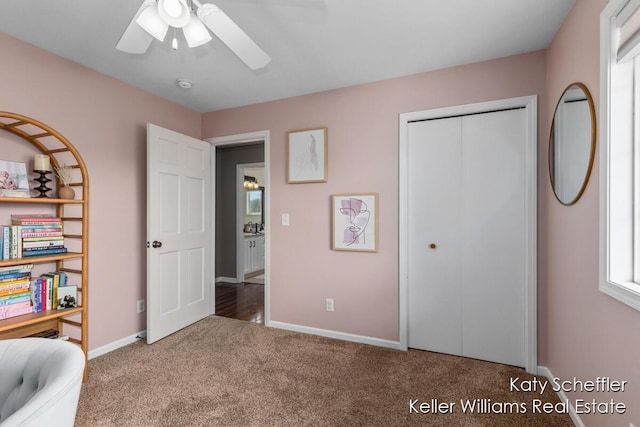 carpeted bedroom featuring baseboards, ceiling fan, and a closet
