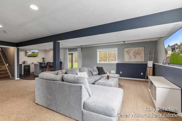 carpeted living room featuring recessed lighting, baseboards, wine cooler, bar area, and stairway