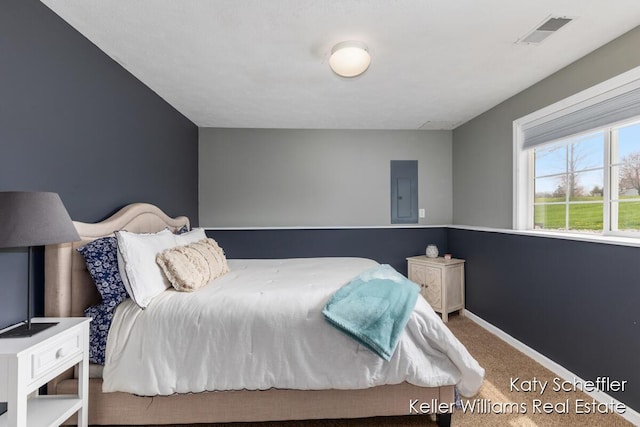 carpeted bedroom featuring baseboards, electric panel, and visible vents