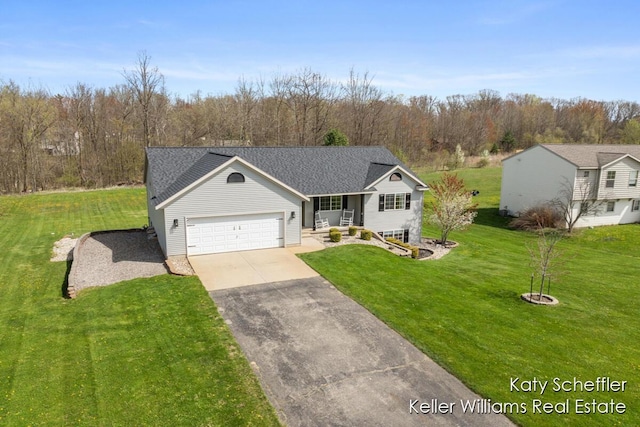 view of front of property with a garage, a front lawn, aphalt driveway, and covered porch