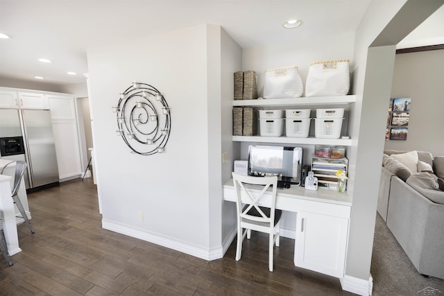home office with recessed lighting, dark wood-style floors, and built in study area