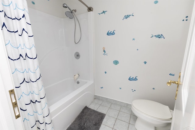 full bath with baseboards, tile patterned flooring, toilet, and shower / tub combo