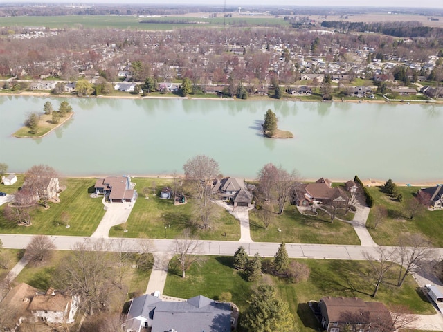 birds eye view of property with a residential view and a water view