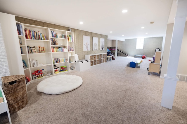 playroom with carpet floors, recessed lighting, visible vents, and ornate columns