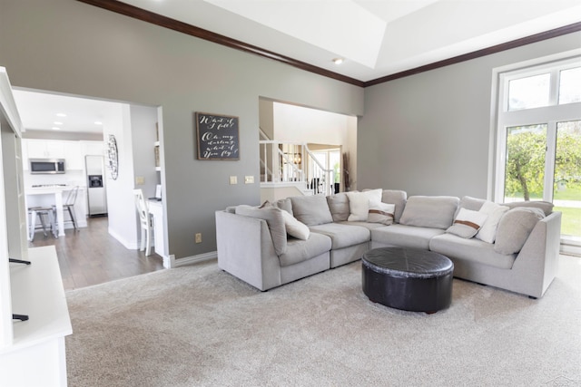 living room featuring stairway, ornamental molding, carpet, and recessed lighting