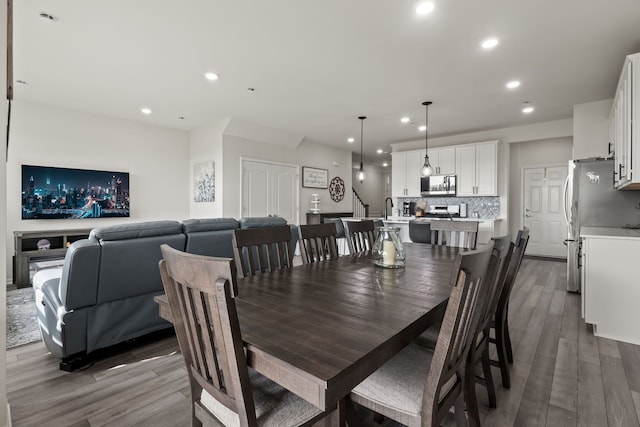 dining area featuring recessed lighting and dark wood-type flooring