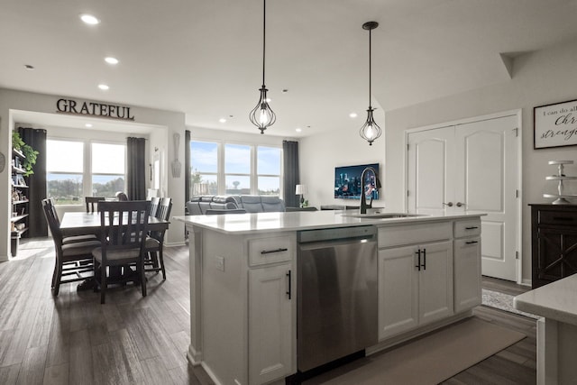 kitchen featuring a sink, a healthy amount of sunlight, recessed lighting, and dishwasher