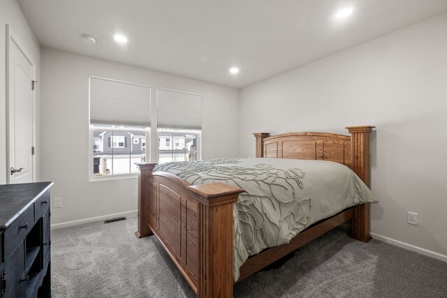 bedroom featuring baseboards, visible vents, recessed lighting, and light colored carpet