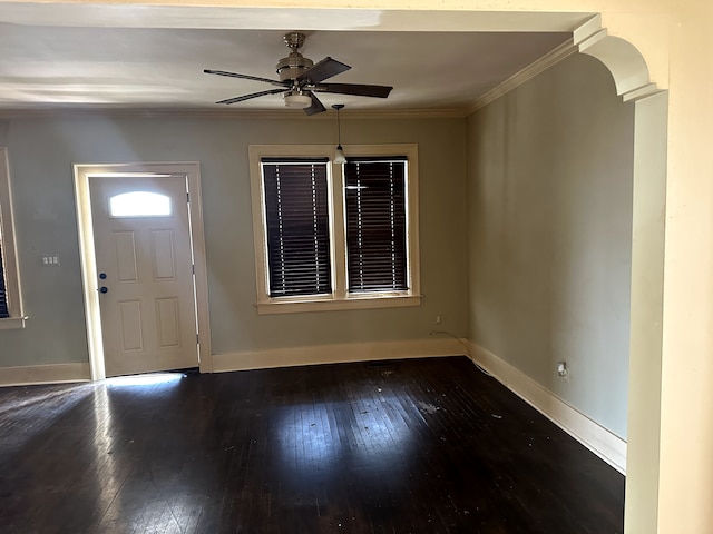 entryway featuring baseboards, ornamental molding, a ceiling fan, and hardwood / wood-style flooring