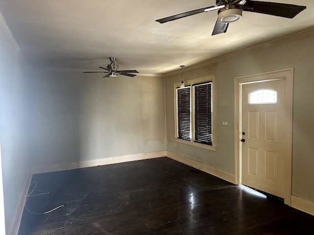 entryway featuring crown molding, baseboards, a ceiling fan, and wood finished floors