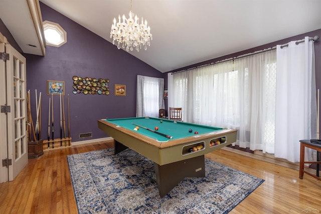 game room with light wood-style floors, pool table, an inviting chandelier, and vaulted ceiling