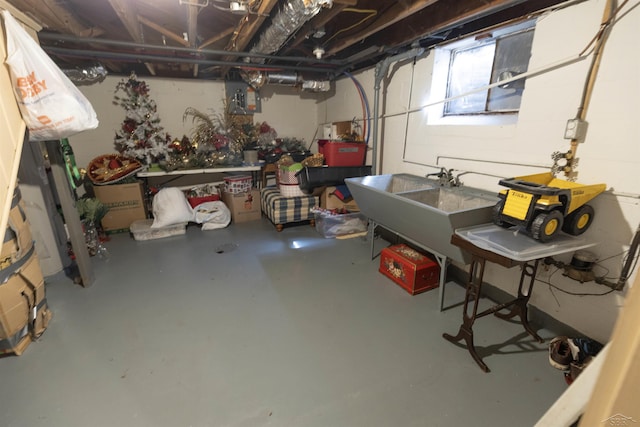 below grade area with a sink