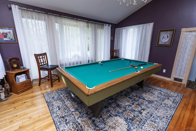 recreation room with billiards, baseboards, hardwood / wood-style floors, and lofted ceiling