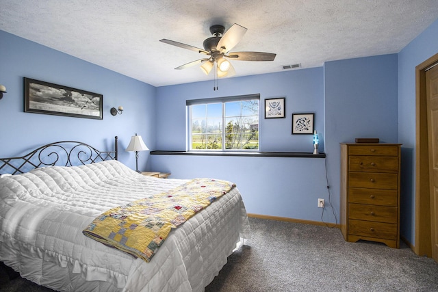 1077 Sun Valley Ln, Allegan, MI 49010 - carpeted bedroom featuring visible vents, a textured ceiling, baseboards, and ceiling fan