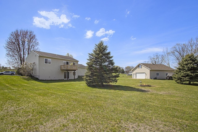 1077 Sun Valley Ln, Allegan, MI 49010 - view of yard featuring a garage and a deck