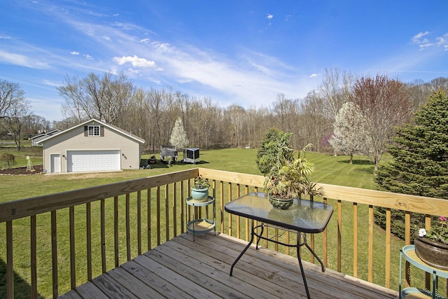 1077 Sun Valley Ln, Allegan, MI 49010 - deck with an outdoor structure, central AC unit, a yard, and a detached garage