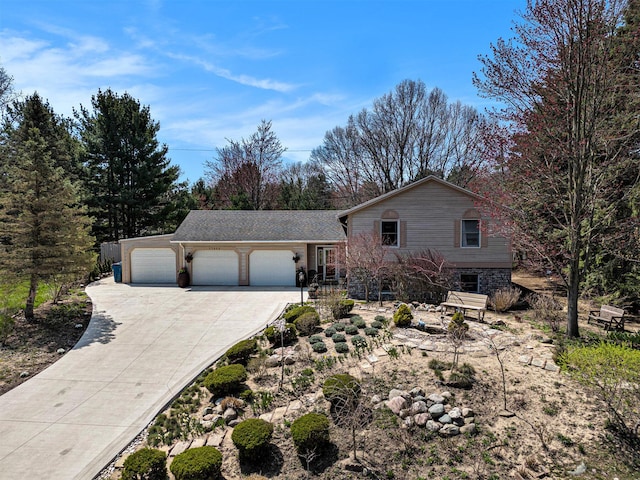 view of front of house with an attached garage and concrete driveway