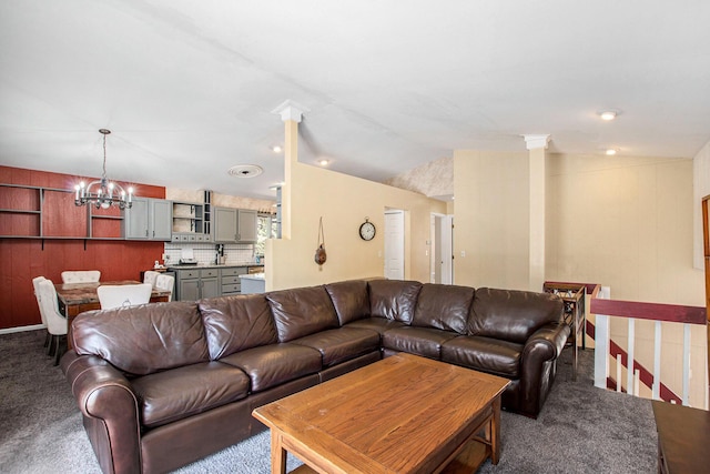 carpeted living room with vaulted ceiling and a notable chandelier