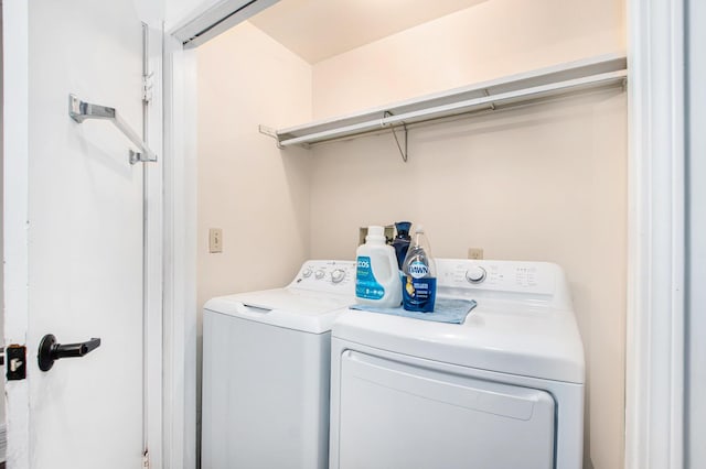 laundry area with laundry area and washer and clothes dryer