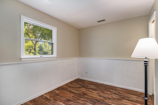 17653 Hiawatha Dr, Spring Lake, MI 49456 - empty room with dark wood-style flooring and baseboards