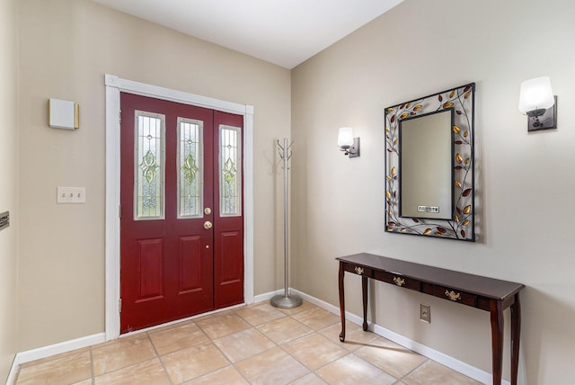 17653 Hiawatha Dr, Spring Lake, MI 49456 - foyer with baseboards and light tile patterned flooring