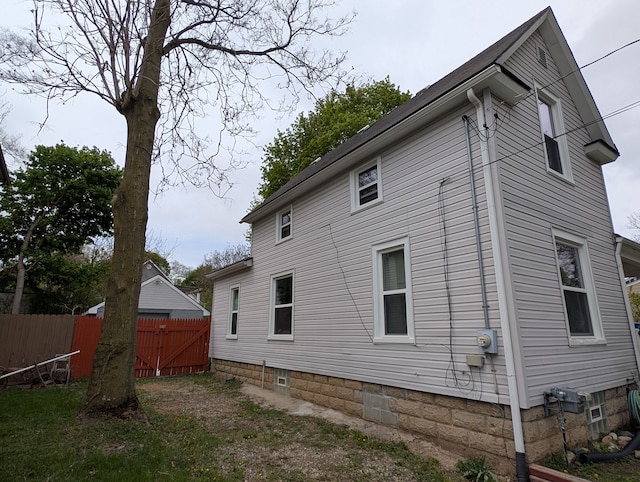 162 Perkins St, Pontiac, MI 48342 - view of home's exterior with fence and a gate