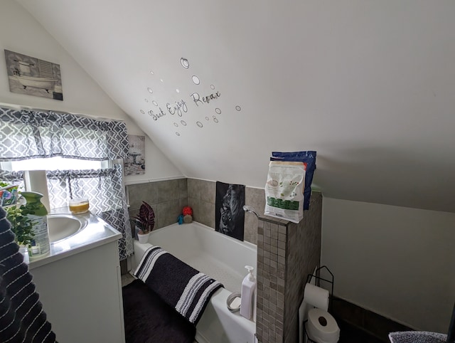 162 Perkins St, Pontiac, MI 48342 - bathroom with vaulted ceiling, a garden tub, and vanity