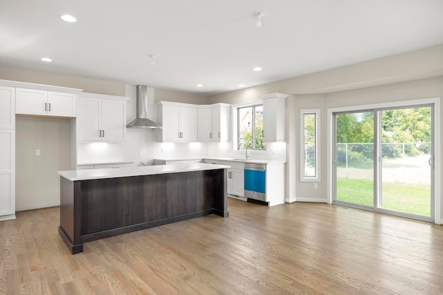 1685 E Wattles Rd, Troy, MI 48085 - kitchen featuring a sink, wall chimney exhaust hood, light wood-style flooring, a center island, and stainless steel dishwasher