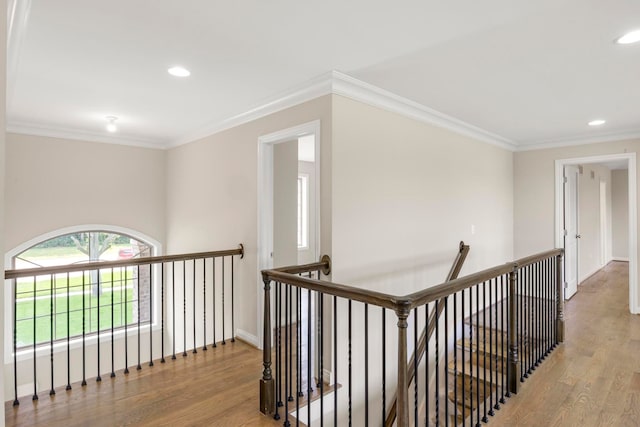 corridor featuring recessed lighting, light wood finished floors, baseboards, and an upstairs landing