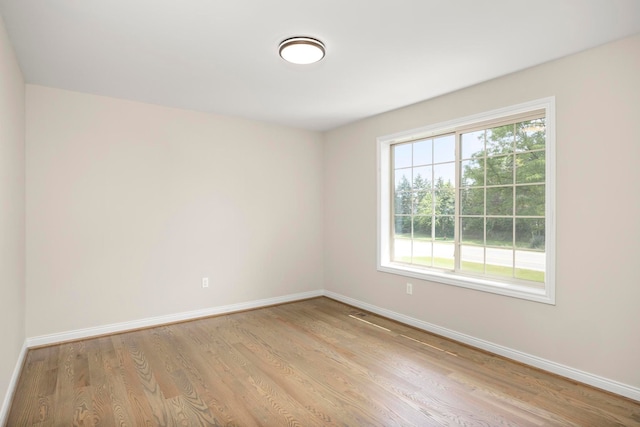 1685 E Wattles Rd, Troy, MI 48085 - spare room featuring baseboards and wood finished floors