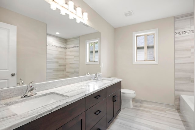1685 E Wattles Rd, Troy, MI 48085 - bathroom with a sink, toilet, a wealth of natural light, and a tile shower