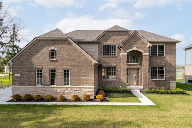 1685 E Wattles Rd, Troy, MI 48085 - view of front of house featuring a shingled roof, brick siding, and a front yard