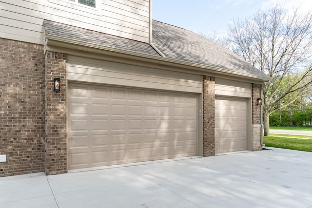 1685 E Wattles Rd, Troy, MI 48085 - garage with concrete driveway