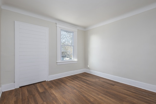 574 Melbourne St, Detroit, MI 48202 - spare room featuring baseboards and dark wood-type flooring
