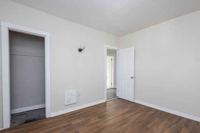 574 Melbourne St, Detroit, MI 48202 - unfurnished bedroom featuring baseboards, a closet, wood finished floors, and visible vents